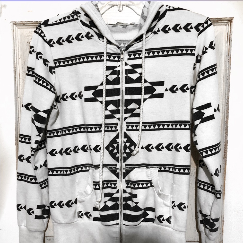 White and black long sleeve sweater.
